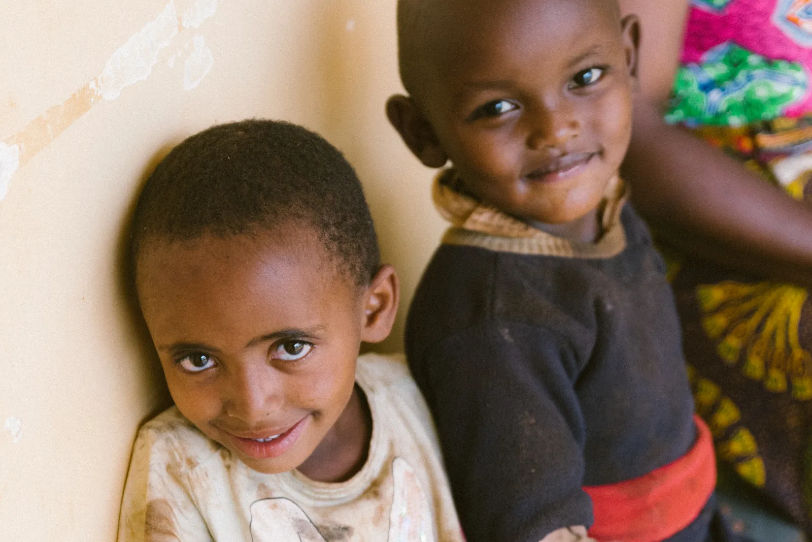 Two children smiling at the camera