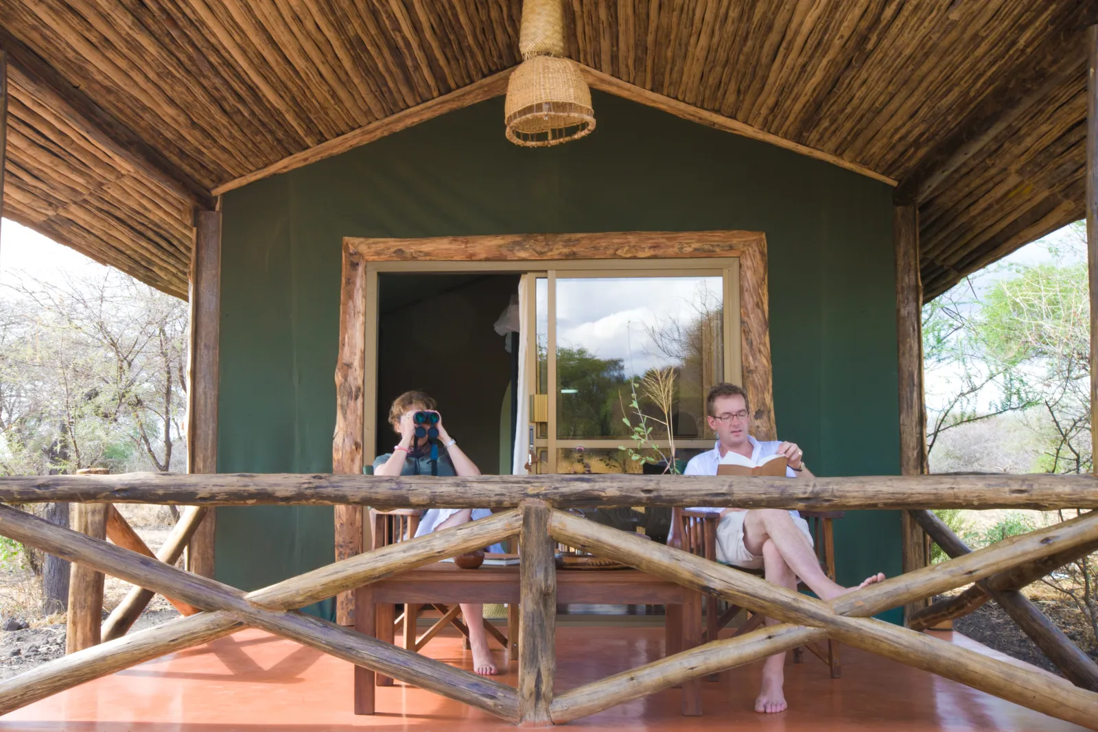 Guests on the verandah of a Tarangire tented cottage